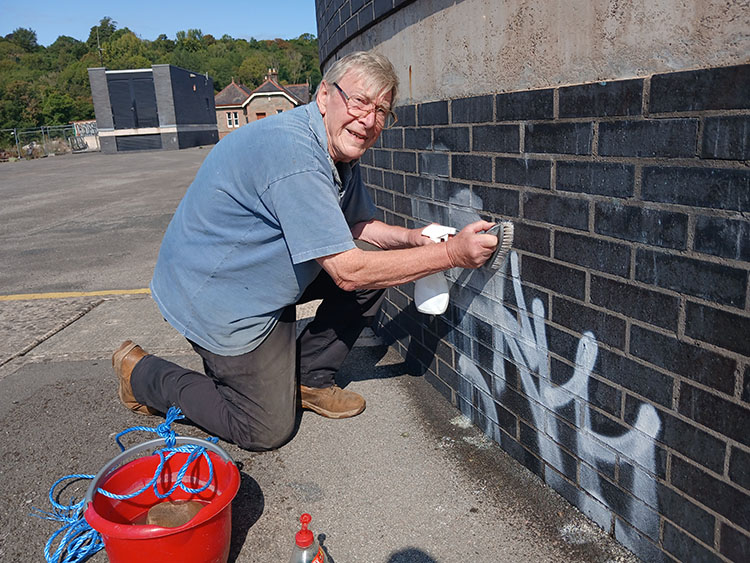 John very effectively removing all traces of graffiti